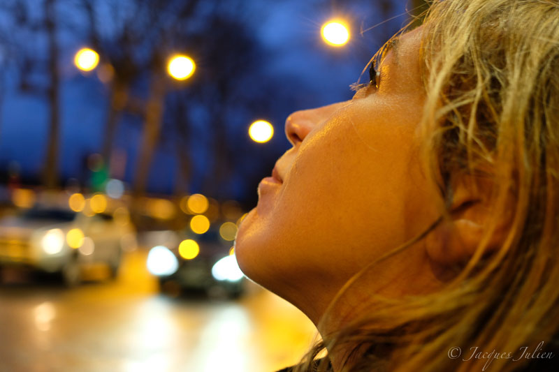 woman portrait with cars at night