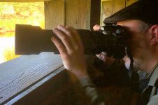bird photographer in a hide