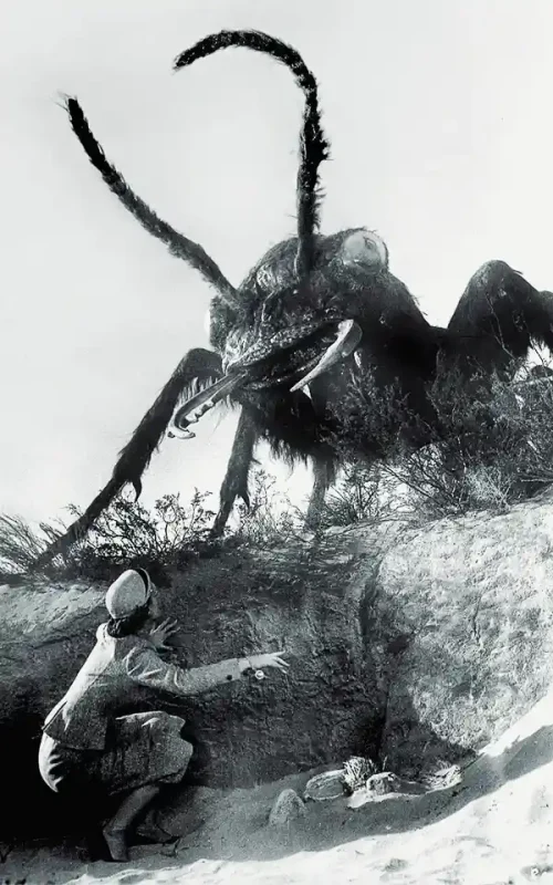 Black and white still from the 1954 science fiction film Them! featuring a giant mutant ant, allegory for invisible nuclear threat during the Cold War era